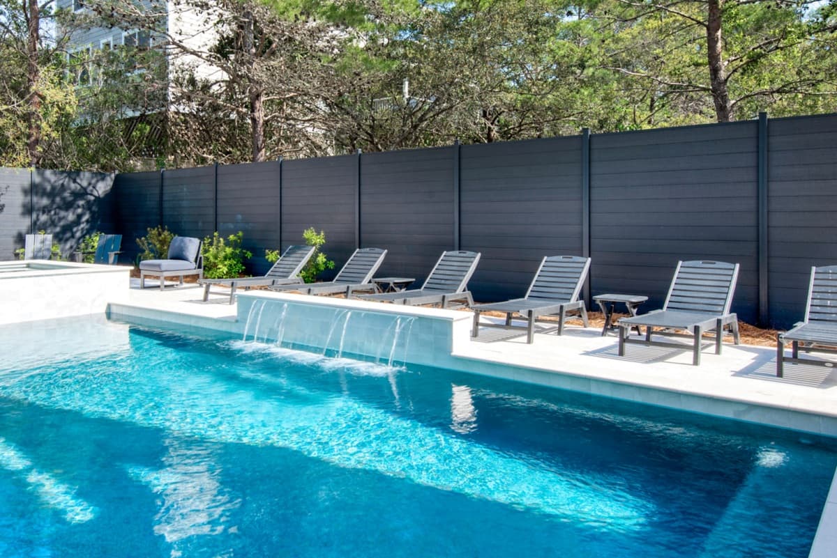 Aluminum Frame System fence sections near a pool patio.
