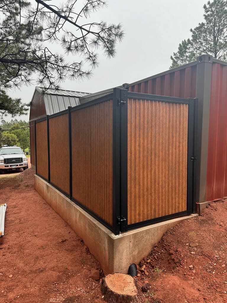 Designer Metal gate matching a corrugated metal privacy fence