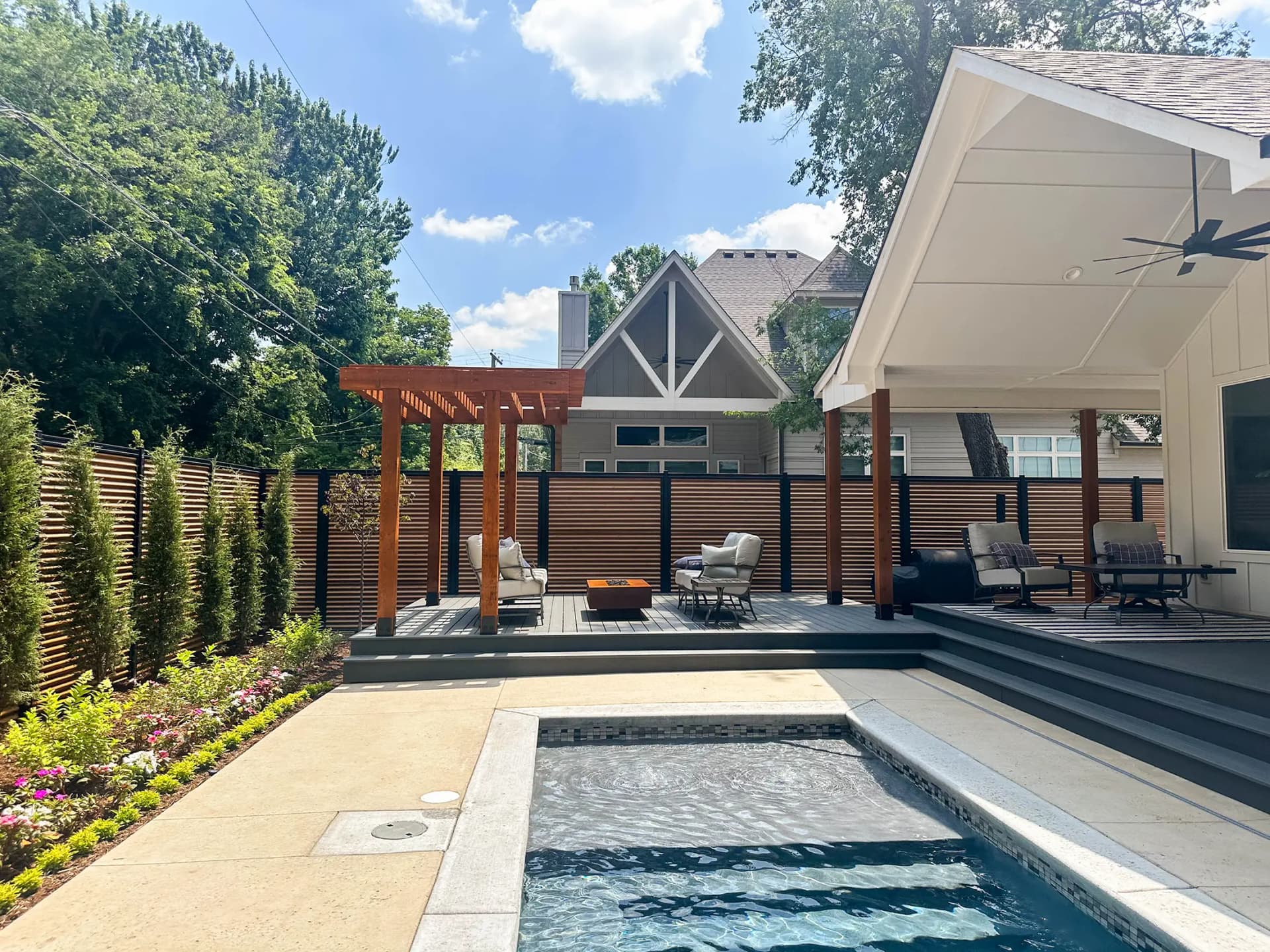 Premium steel-framed privacy fence installation with modern horizontal boards.