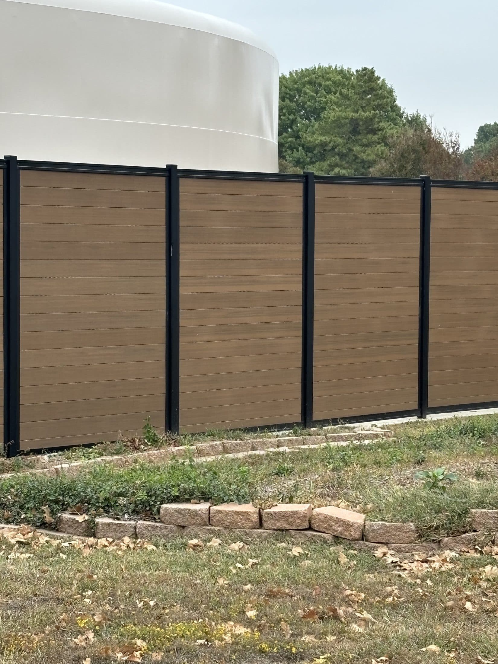 Commercial fence perimeter with clean modern lines and controlled access points.