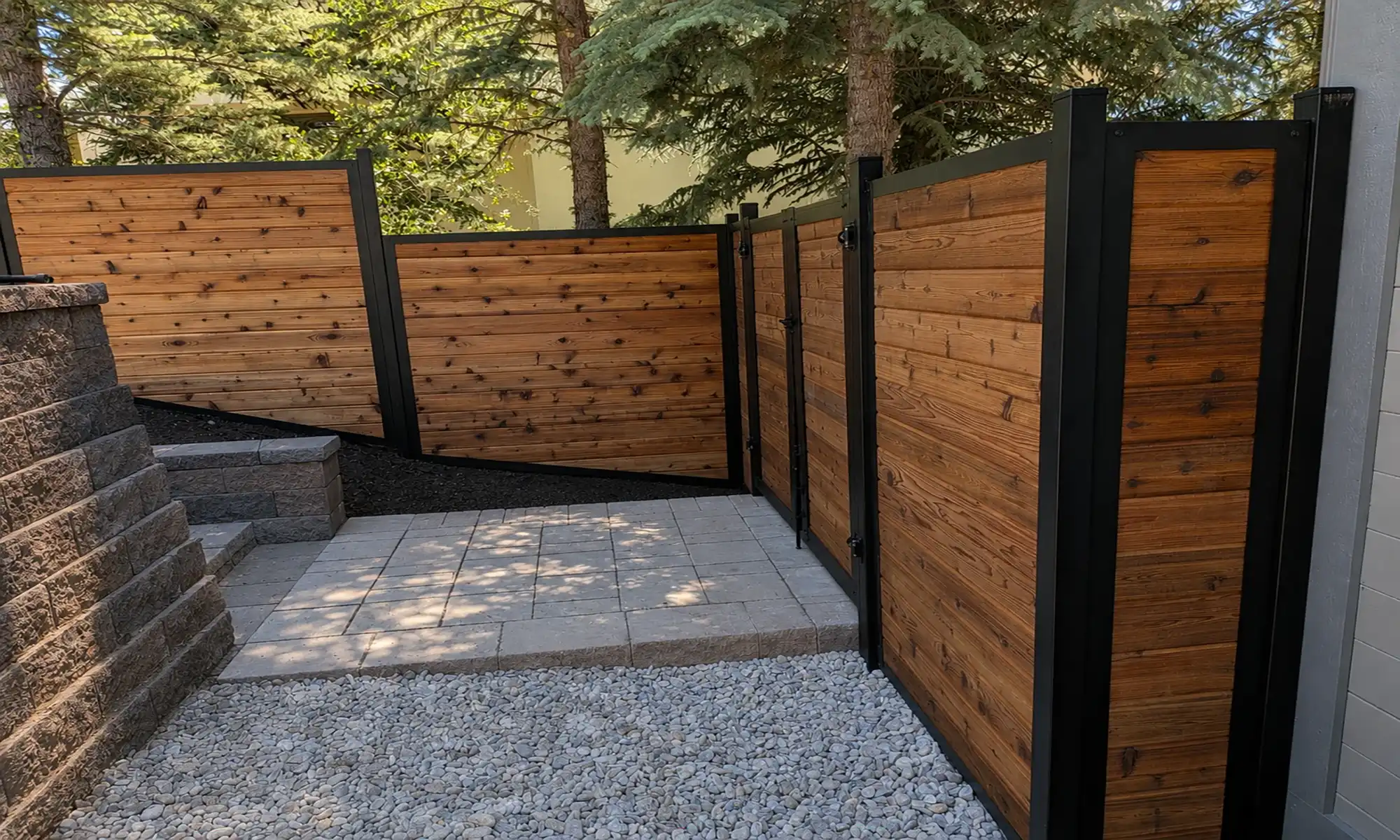 Steel Frame fence system with cedar infill in a finished residential installation.