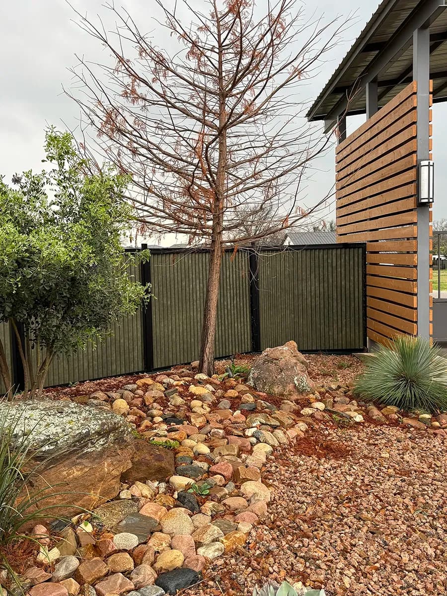 Corrugated metal fence panel detail