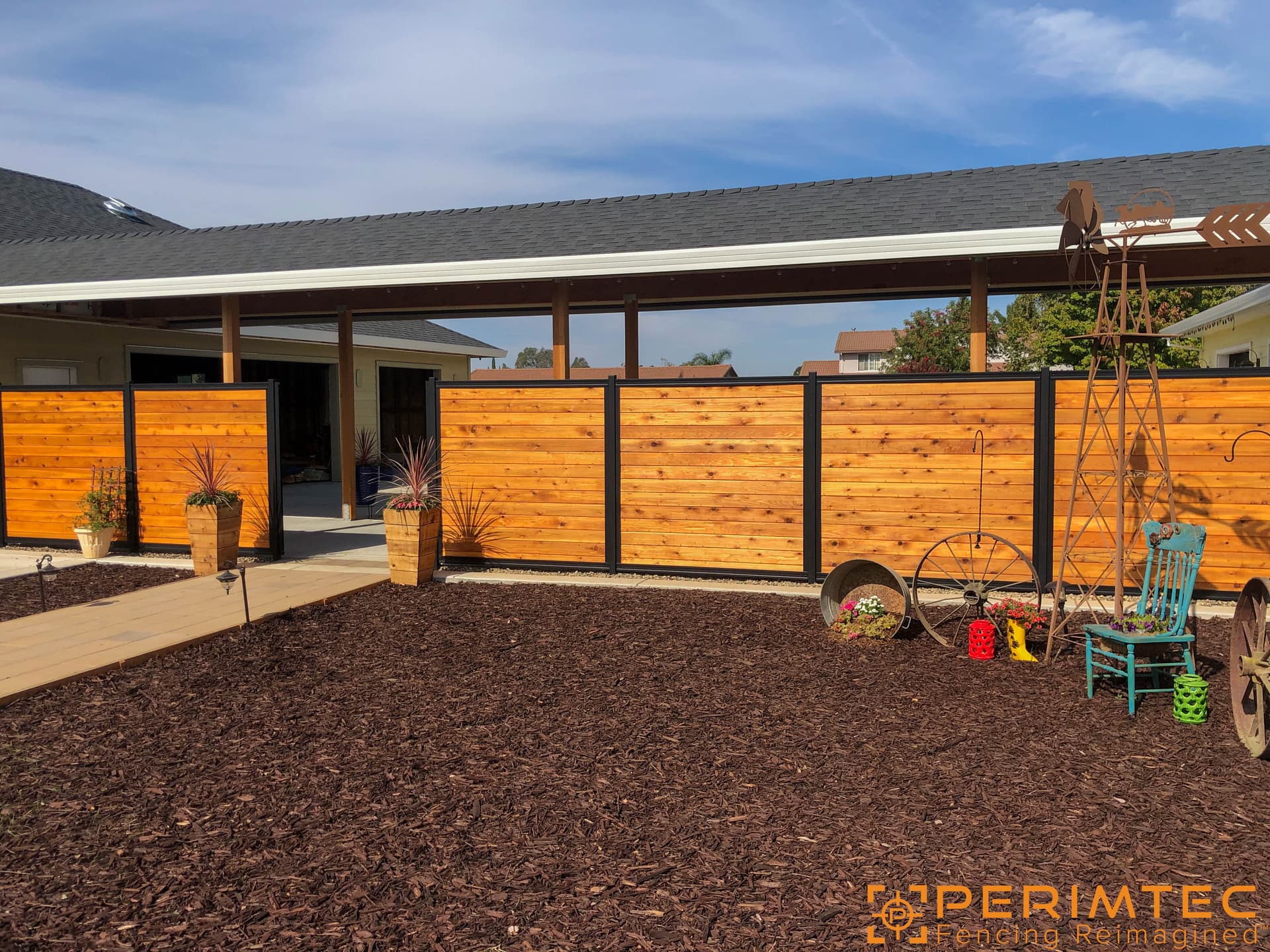 Steel Frame System fence section with horizontal wood infill.