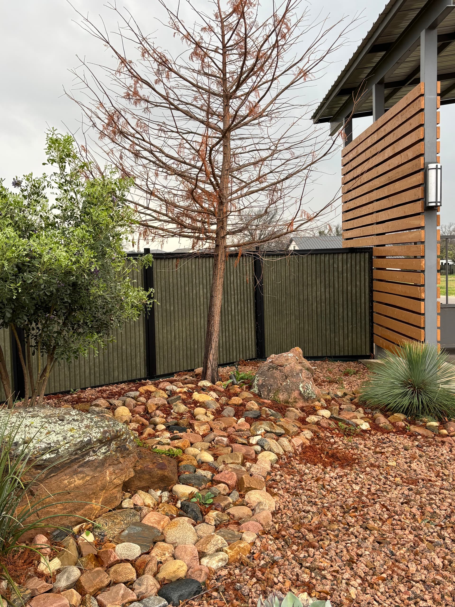 Corrugated metal fence panel detail