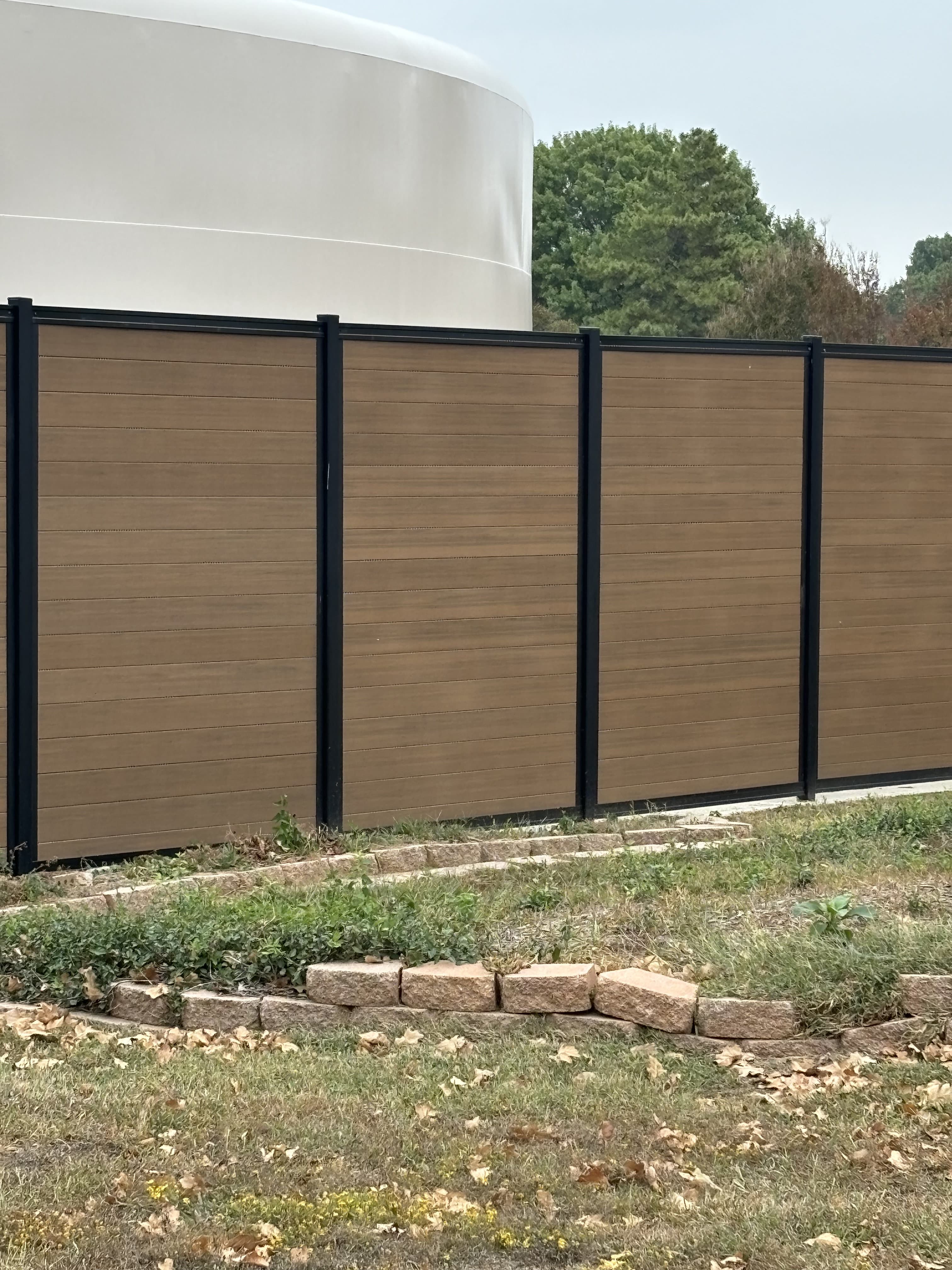 Commercial fence perimeter with clean modern lines and controlled access points.