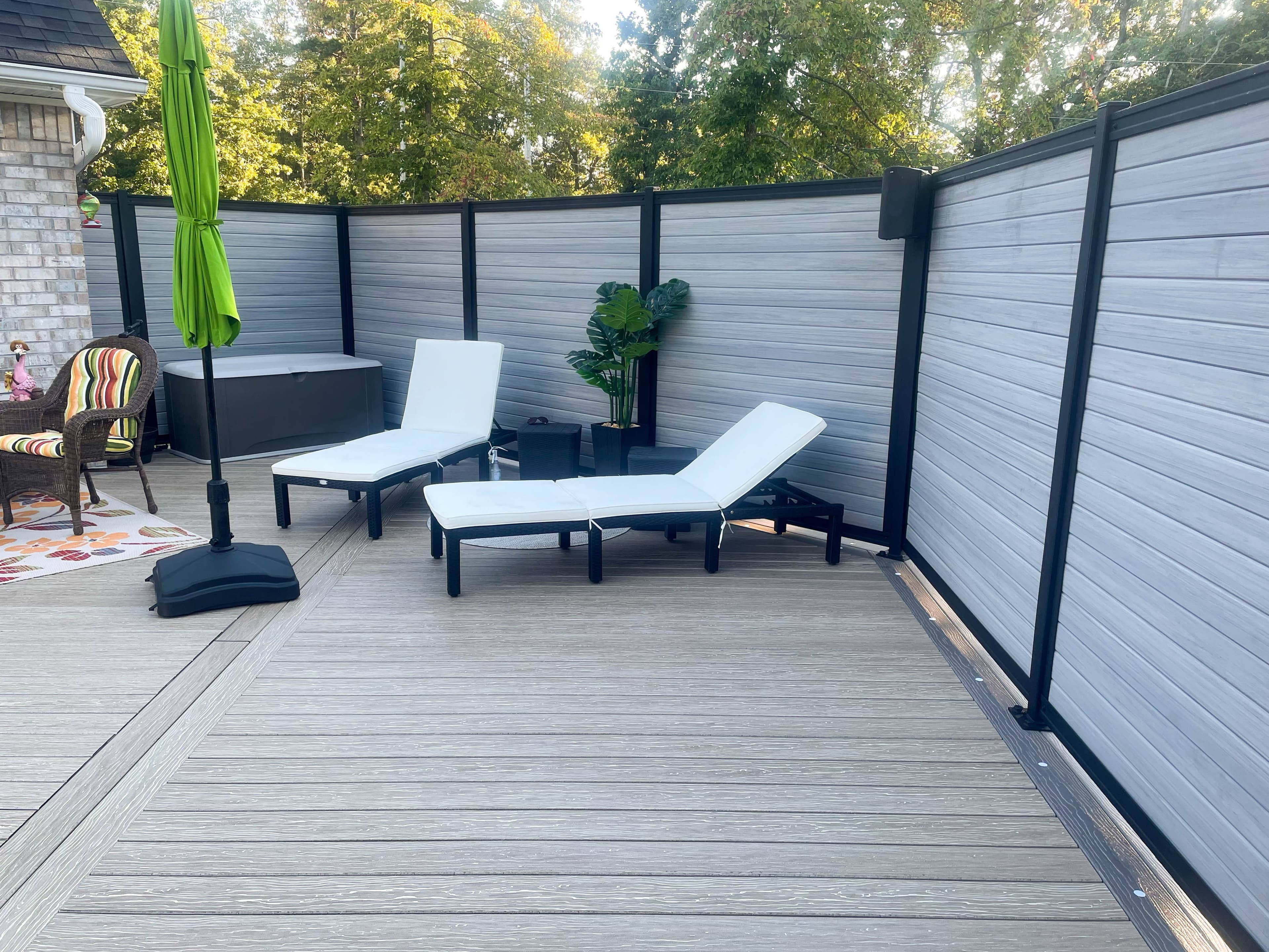 Architectural wood-and-steel fence line at a premium residential project.