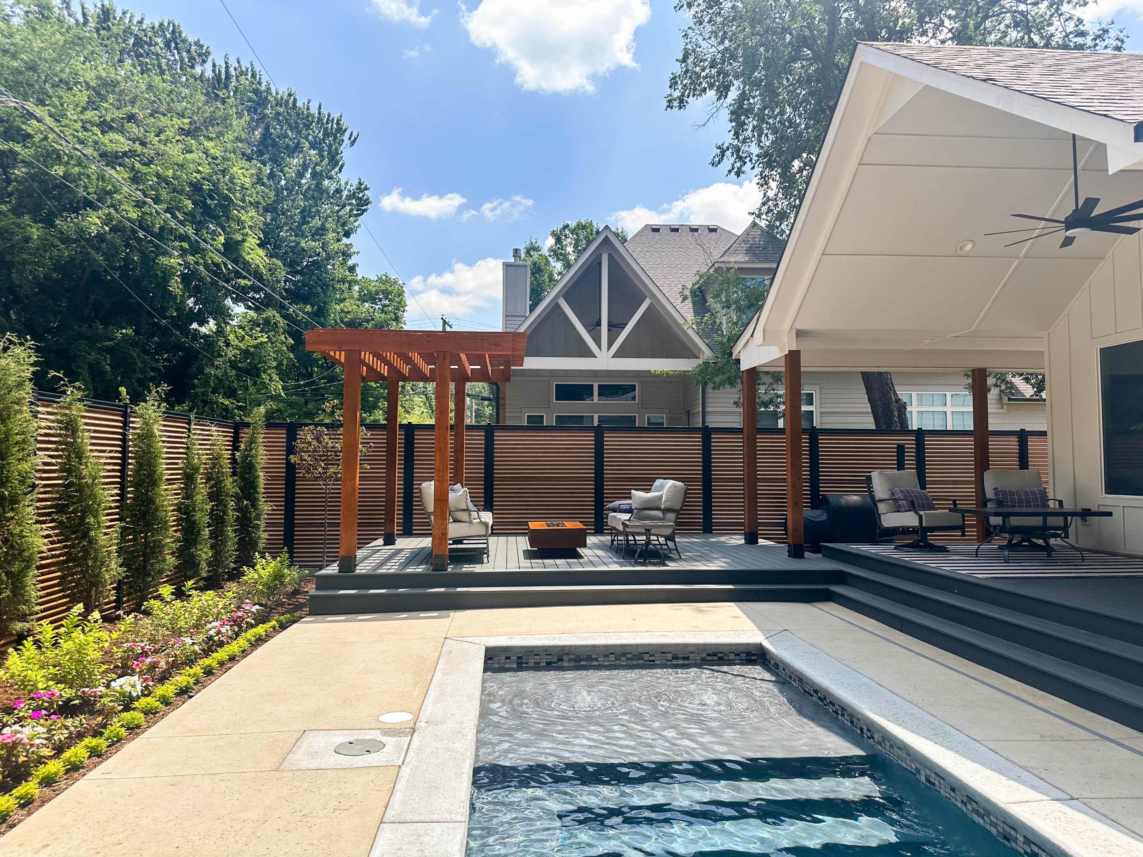 Premium steel-framed privacy fence installation with modern horizontal boards.