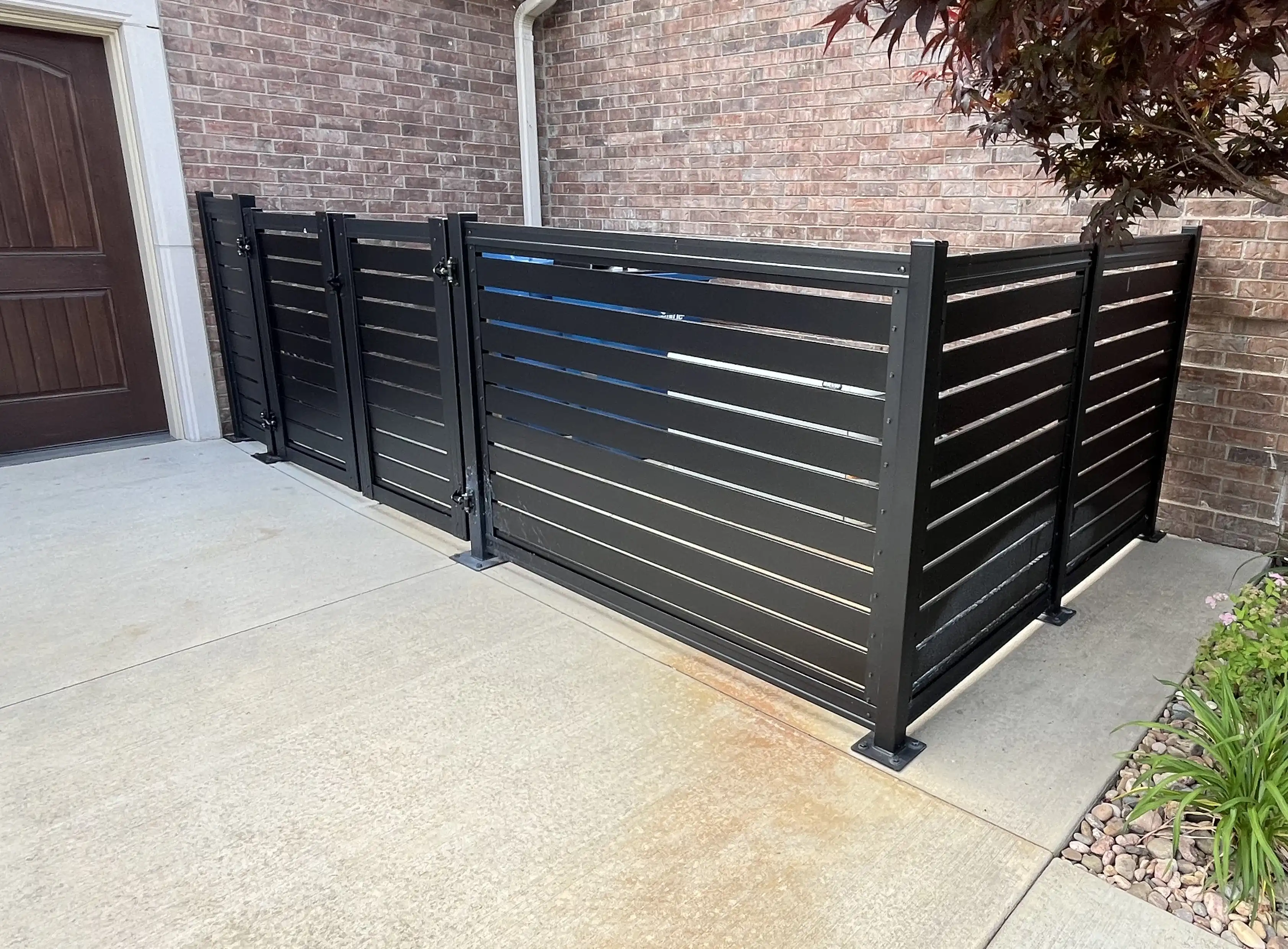 Residential framed fence with semi-private airflow-friendly spacing and warm infill tone.