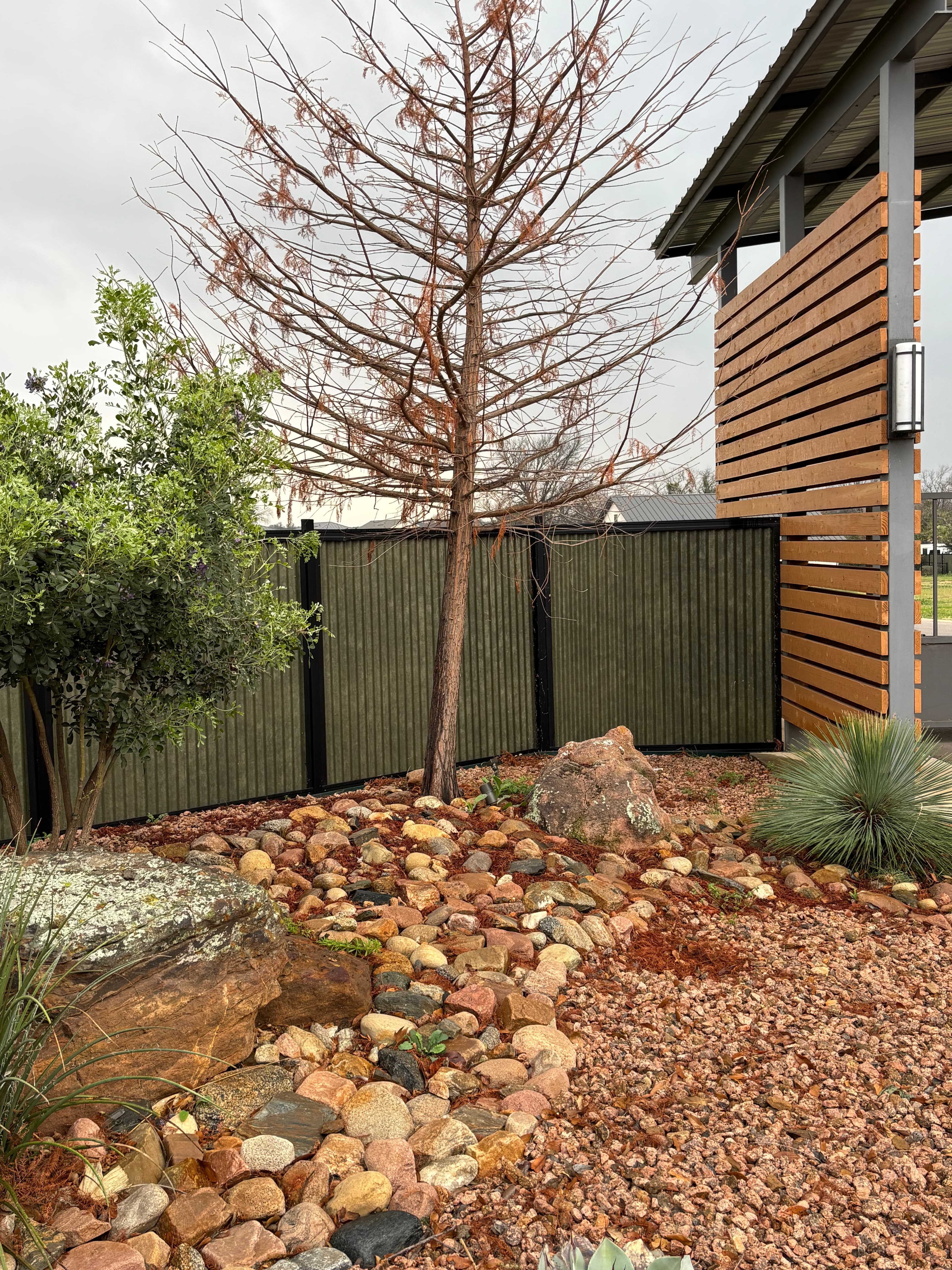 Corrugated metal fence panel detail